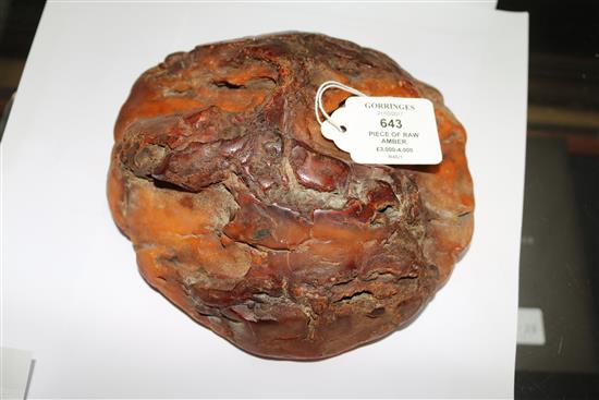 A large piece of raw amber, gross weight 1084 grams, approx. 7in by 7in by 3in.